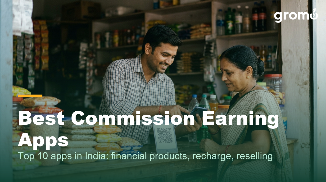 Indian shop owner earning recharge commission by helping a customer on his smartphone
