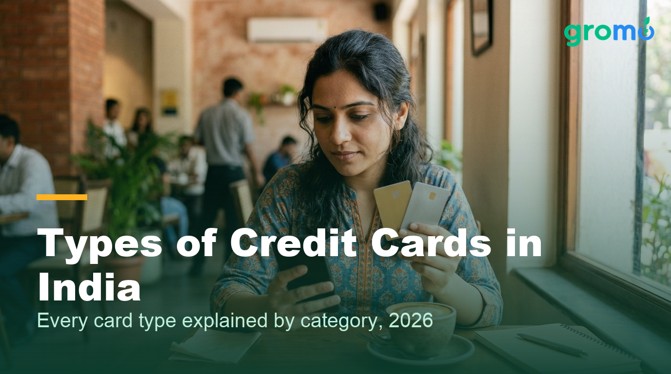 Indian woman comparing different types of credit cards at a cafe