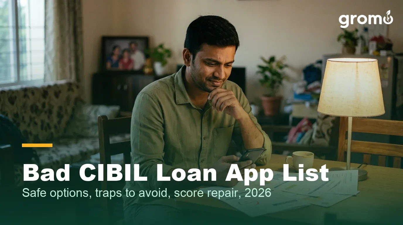Indian man reviewing bad CIBIL loan app options and his credit score at home