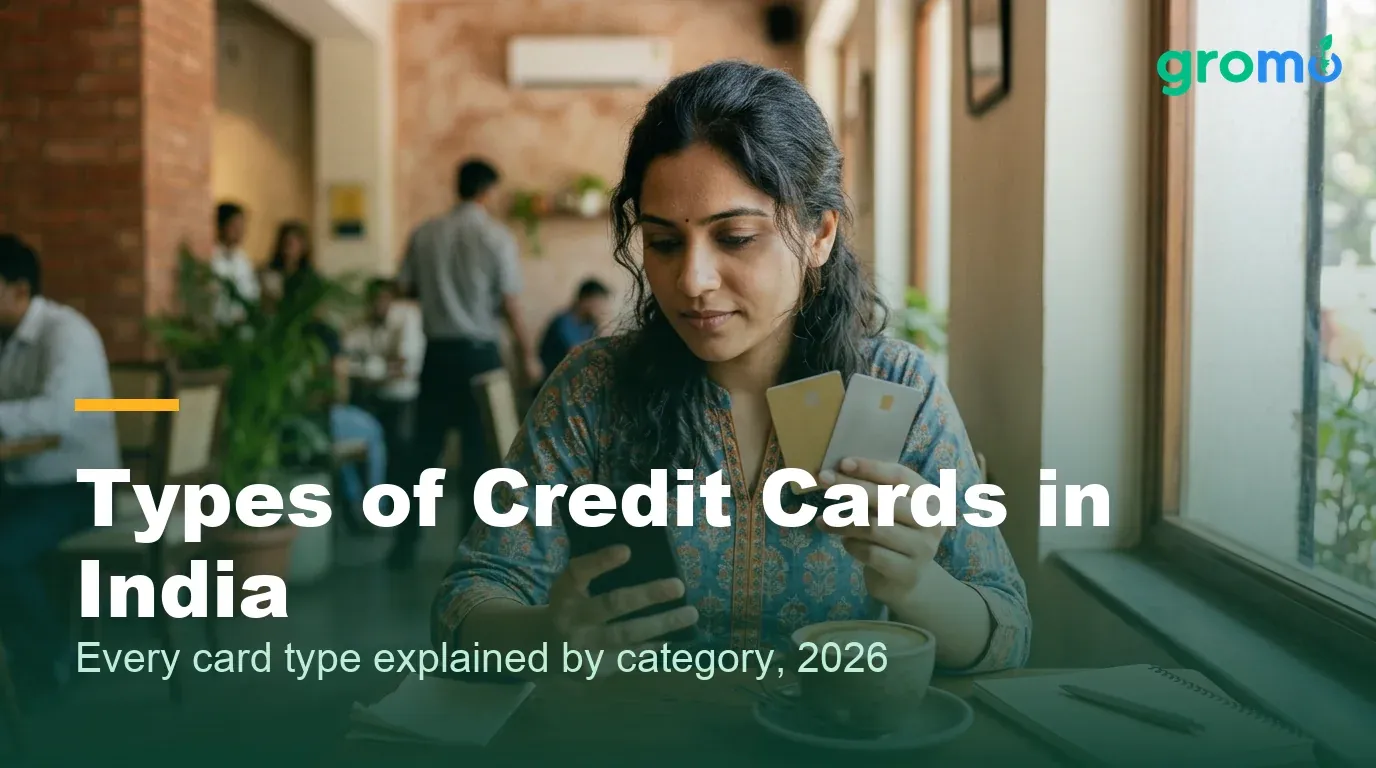 Indian woman comparing different types of credit cards at a cafe