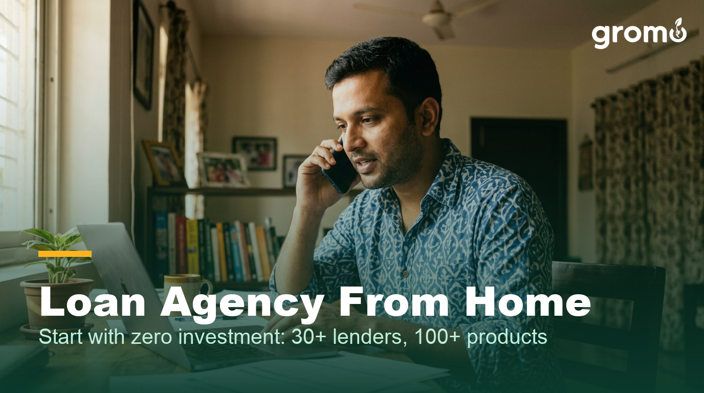 Indian man running his loan agency business from his home office with phone and laptop
