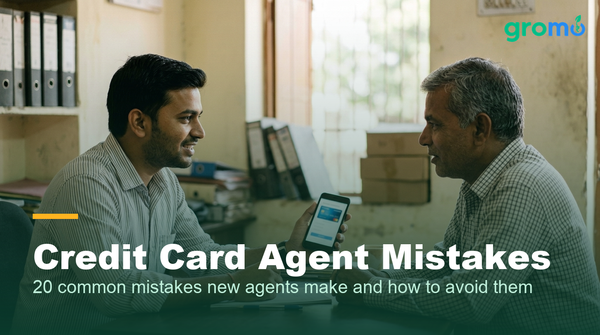 Indian credit card agent showing a card comparison to a customer on his phone