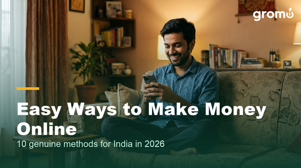 Young Indian man making money online easily using his smartphone at home