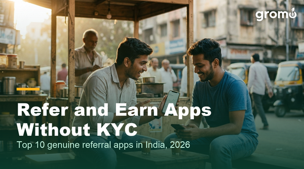 Indian friends sharing a refer and earn app link on their phones at a tea stall