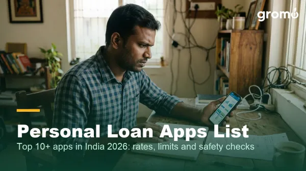 Indian man comparing personal loan apps on his smartphone at home