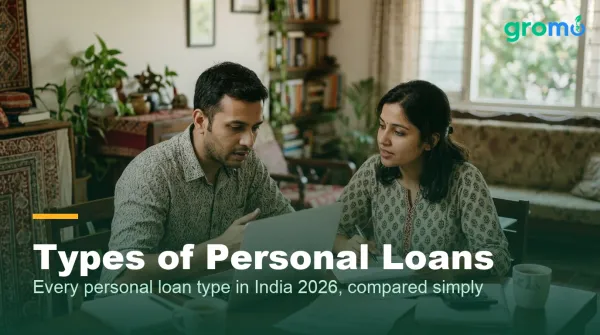 Indian couple comparing types of personal loans at home with a laptop and calculator